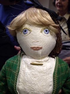 Detail of beautiful embroidered features and eyelashes!