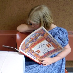 Julia enjoying favorite pastime, reading!